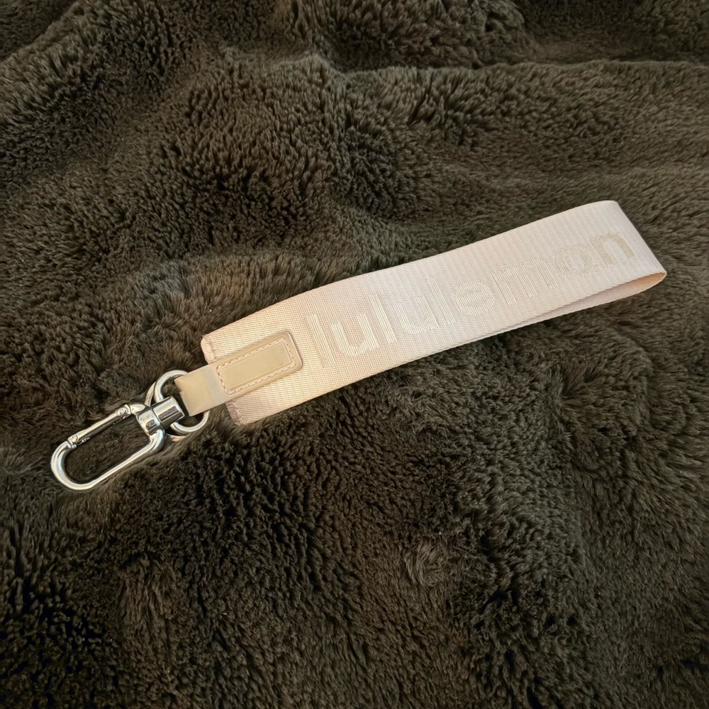 Light pink Lululemon never lost keychain